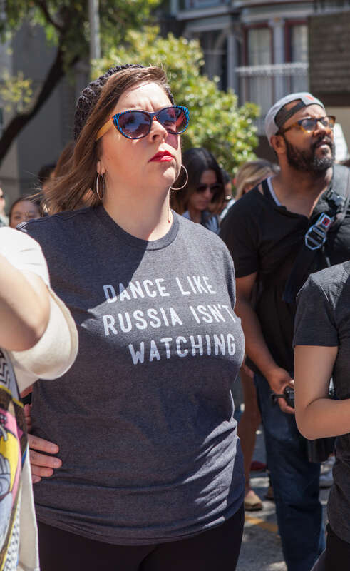 A protester wearing a shirt reading &quot;Dance Like Russia Isn't Watching&quot; attends a Patriot Prayer counter-protest in San Francisco.