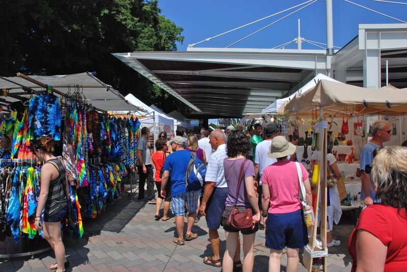 The Saturday Market, in Portland, Oregon. This view is looking north along the west side of the covered area (also known as the &quot;pavilion&quot;) at the market's post-2008 location, in Tom McCall Waterfront Park immediately south of the Burnside Bridge.