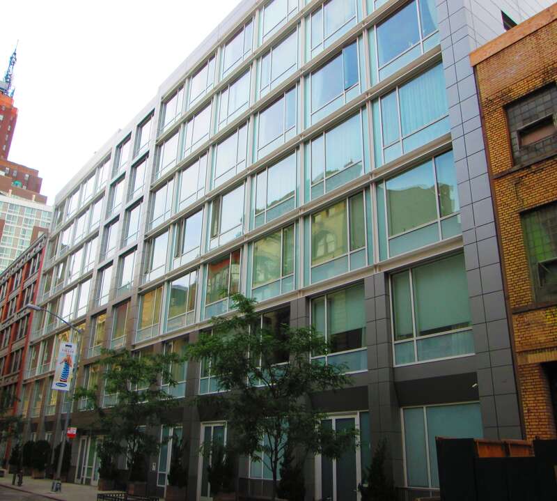 Soho Mews, a luxury cooperative apartment building located at 311 West Broadway between between Grand and Canal Streets in the SoHo neighborhood of Manhattan, New York City, with a second building at 9-21 Wooster Street and a garden between them.  It