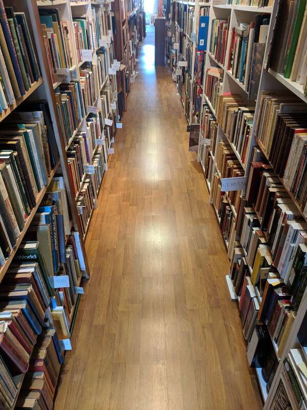 The Bookplate, a bookshop on South Cross Street in Chestertown, Maryland, featuring fine books, fine art, and a cat.
