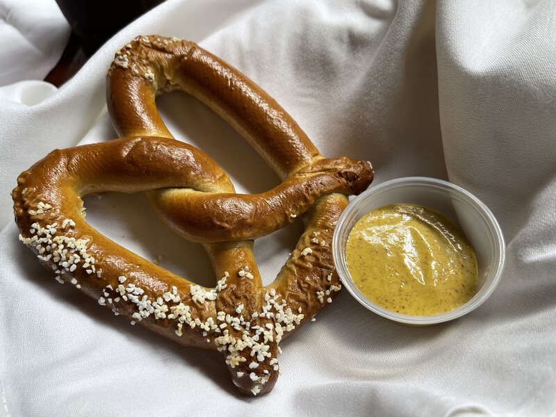 Pretzel with hot mustard at The Rathskeller, Indianapolis, Indiana.