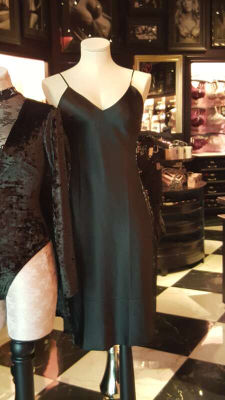 Full slip on the right side and partley an evening bodysuit to the left side at a Victoria's Secret store