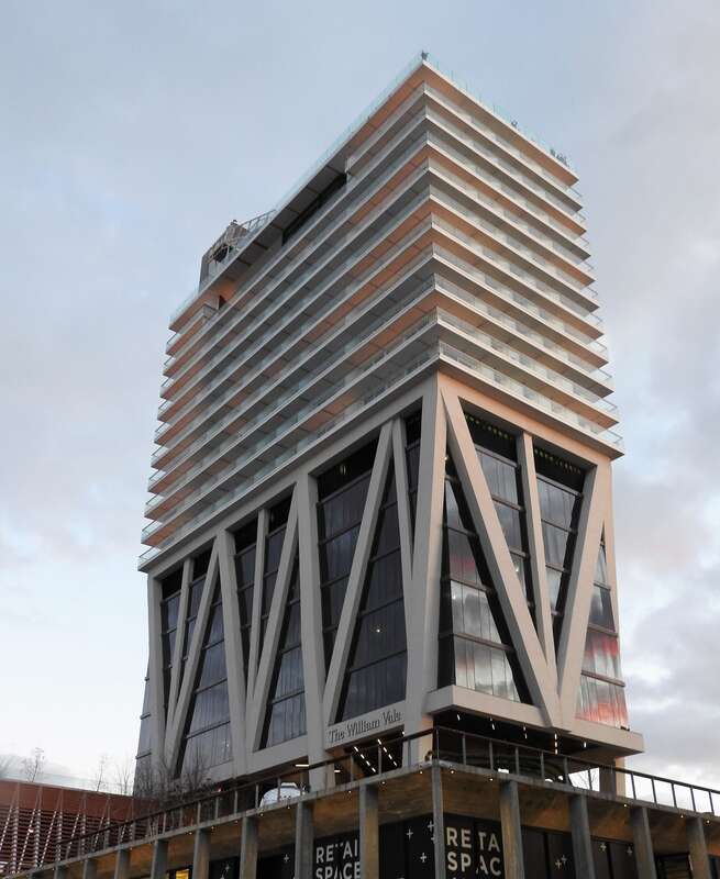Looking east at hotel illuminated by early twilight