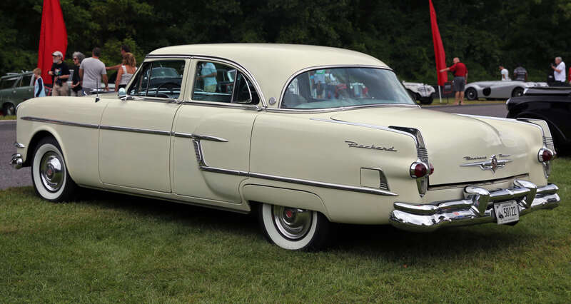 1954 Packard Patrician Touring Sedan at the 2014 Lime Rock Concours d'Élegance. Series 54, model number 5452. Desert Sand over Light Tan Broadcloth. It has the 359ci straight-eight and the Ultramatic transmission, and original AM radio with power
