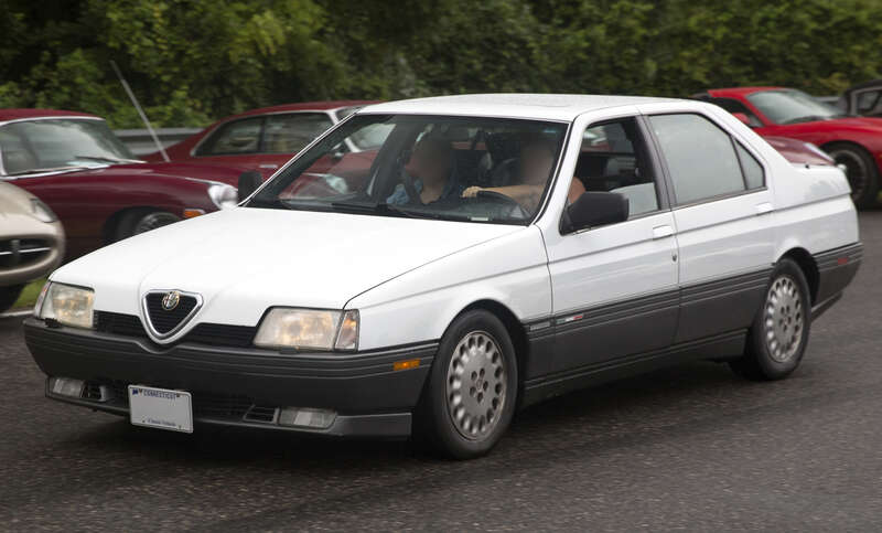 1991 Alfa Romeo 164L Automatic in Bianco Freddo taking part in the Meeting of the Marques at the 2021 Lime Rock Historic Festival.