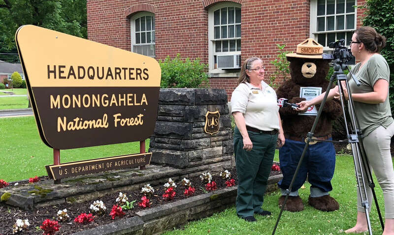 Julie Fosbender, Natural Resource Specialist, and Smokey Bear were interviewed by Leah Knicely with WBOY at the Monongahela National Forest Supervisor’s Office in Elkins, June 27, 2018. (USDA Forest Service photo by Kelly Bridges)