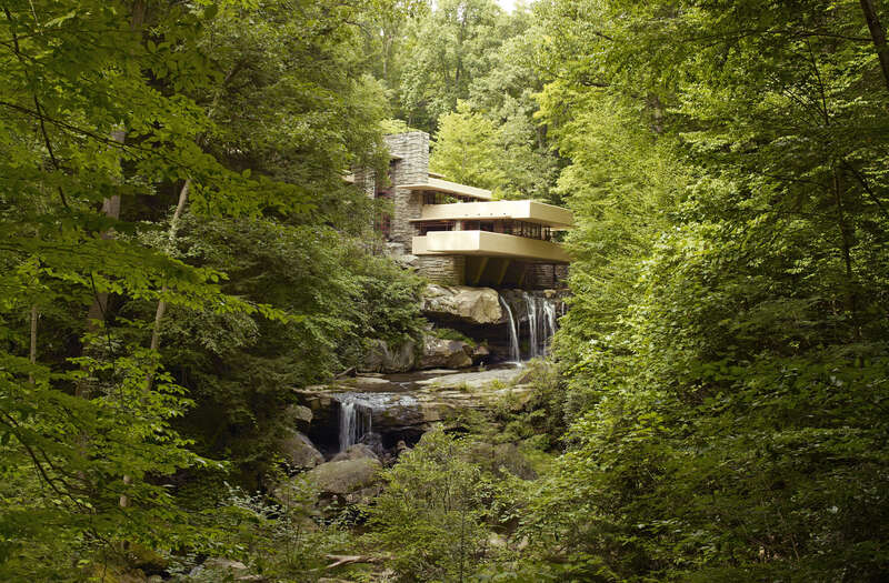 Fallingwater is a house designed by American architect Frank Lloyd Wright in 1934 in rural southwestern Pennsylvania, 50 miles southeast of Pittsburgh, and is part of the Pittsburgh Metro Area. The house was built partly over a waterfall in Bear Run