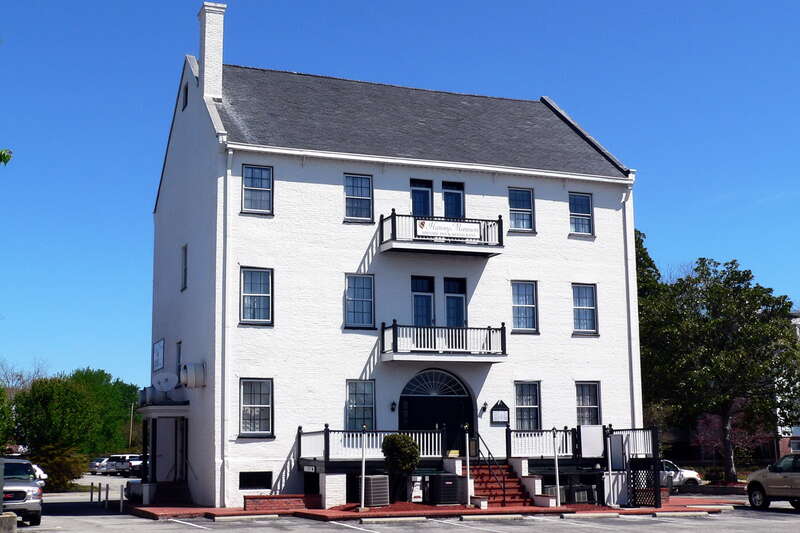 Federal style brick structure built by John Harvey, ship owner and merchant. The building served as an unusual combined residence, office, and storage area for his mercantile enterprises.