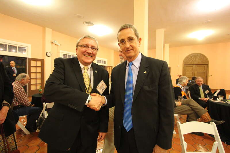Here TSLAC Interim Director and Librarian Edward Seidenberg (left) shakes hands with Texas General Land Office Commissioner Jerry Patterson (right) at a private reception after the ceremony.