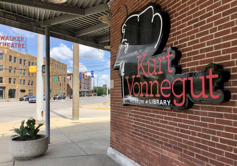 Image of the exterior signage of the Kurt Vonnegut Museum and Library in Indianapolis, Indiana, United States. The photo was captured from the intersection of West St. and Indiana Ave., looking north-northwest. The Madam Walker Legacy Center is