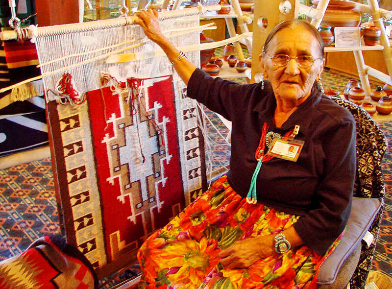 (1 in a multiple picture album)
This lady, perhaps one of the last who know the art, was weaving a blanket in the art store in Mesa Verde National Park.  I asked her if I might take her picture.  In a very soft voice she said, 'Yes, if you pay me.'