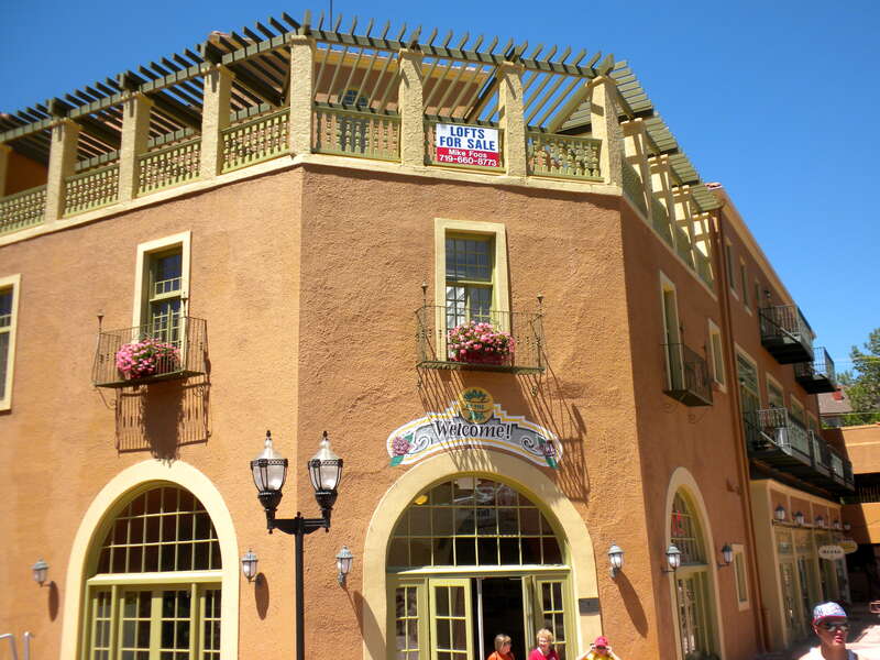 Manitou Bathhouse on the NRHP since August 1, 1979. At 934 Manitou Ave., Manitou Springs, Colorado.  NRHP plaque is barely visible to the right of the door.