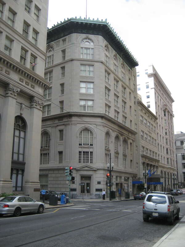New Orleans: Carondelet Street, with view of the Cotton Exchange building on left just past cross-street (Common).
