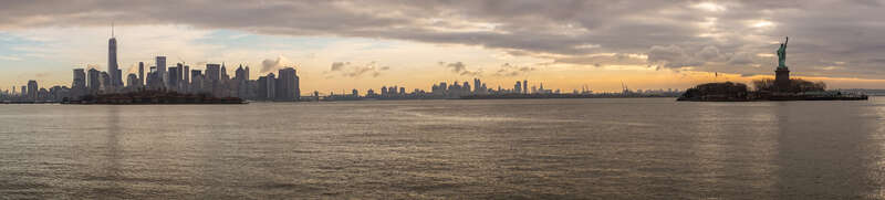 NYC skyline, Ellis Island, and Statue of Liberty right after sunrise.
I was in Los Angeles until after Christmas and then ended up in NYC on New Year's Eve during the day. A friend of mine needed to pick up a car part that was too expensive to ship,