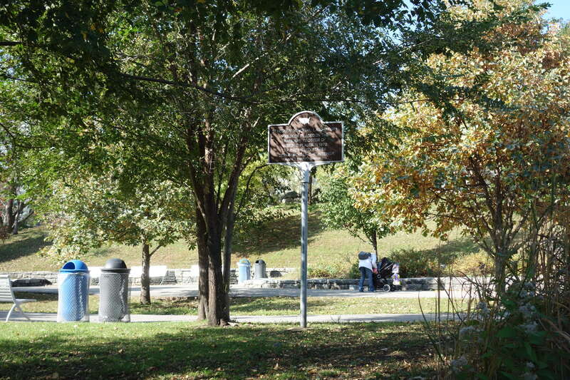 A National Register of Historic Places sign for the Strecker Memorial Laboratory at the east side of Southpoint Park, at East Road south of South Loop Road at approximately Manhattan 53rd Street in the southern half of Roosevelt Island, Manhattan.