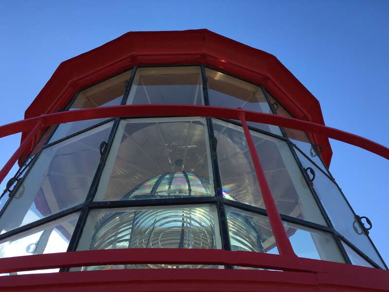The original first order fresnel lens of the St. Augustine Lighthouse still shines out from the lantern.  This is a revolving light, but the design is a bit different than others I've seen.  The top and bottom sections are fixed and only the bullseye