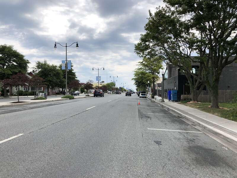 View south along Delaware State Route 1A (Rehoboth Avenue) at Delaware State Route 1B (State Road) in Rehoboth Beach, Sussex County, Delaware