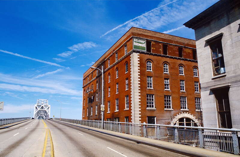 Looking N from Kentucky approach to Clark Bridge (U.S. Highway 31 North).
Belknap Hardware warehouse is being converted to office space for Presbyterian Church (USA) headquarters.
This brick and stone warehouse at 127 W. Washington Street (north-east