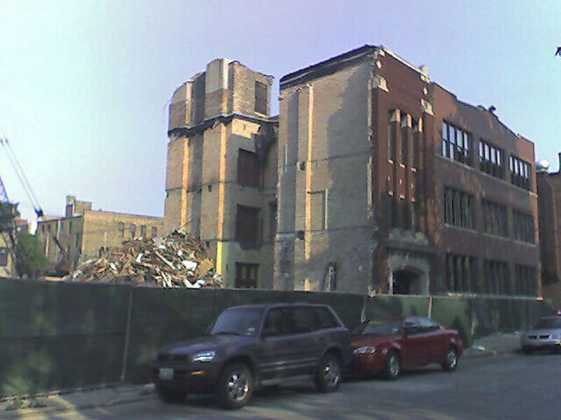 This solid timber loft building at 1609 N. Wolcott puts up a fight against the wrecking ball. It's a victim of a developer with zero creativity, who intends to replace it with elephantine, lookalike McMansions even over the strident objections of the