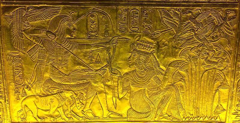 Scene from gilded shrine of Tutankhamen showing him and his wife Queen Ankhesenamun.