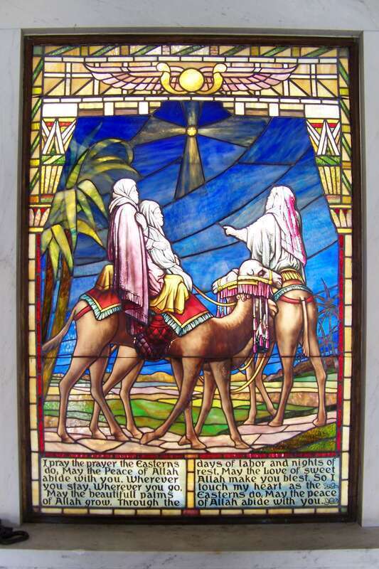 A photo of a stained glass window inside the Bettendorf mausoleum at Oakdale Memorial Gardens in Davenport, Iowa, a contributing building in the National Register of Historic Places listed Oakdale Cemetery Historic District.