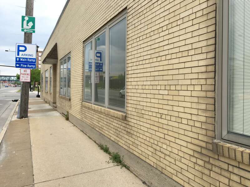 Demolition of a warehouse and office building adjacent to Camera Corner in downtown Green Bay, WI. Camera Corner is set to expand to this area.