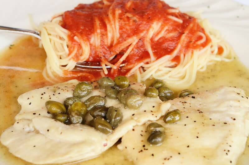 Chicken piccata with capers &amp;amp; white wine with capellini &amp;amp; tomato sauce at Bongiorno Italian Restaurant in Mountain Brook, Alabama. Had it for lunch today.
