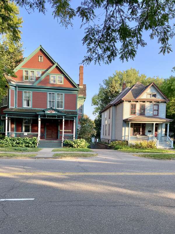 The Knox-Austin House, on the left, was built in 1885 and was designed in the Queen Anne style by James Knox Taylor.  The house was once home to Horace Austin, former governor of Minnesota (1870-1874).  The house on the right was built circa 1905 in