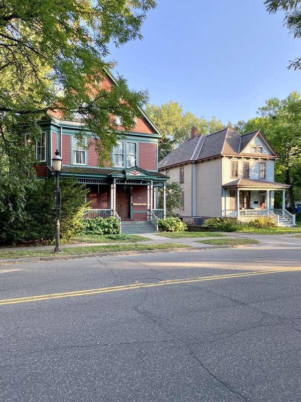 The Knox-Austin House, on the left, was built in 1885 and was designed in the Queen Anne style by James Knox Taylor.  The house was once home to Horace Austin, former governor of Minnesota (1870-1874).  The house on the right was built circa 1905 in