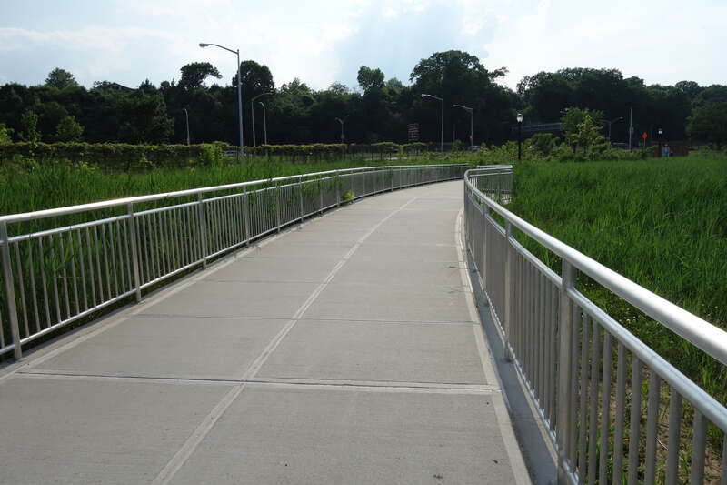 A newly-constructed footbridge on the promenade around Meadow Lake in the Meadow Lake section of Flushing Meadows–Corona Park, on Meadow Lake Drive near Jewel Avenue / 69th Road between Forest Hills and Queensboro Hill, Queens. The bridge crosses a
