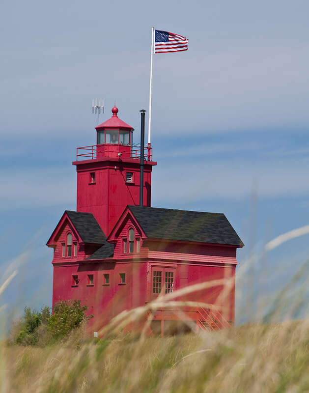 Big Red as it is known, with a unique perspective through the grass with Old Glory waving above.