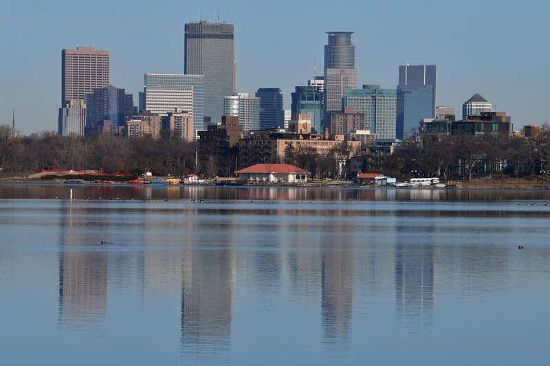 The downtown Minneapolis skyline as viewed behind the refectory at Lake Calhoun.