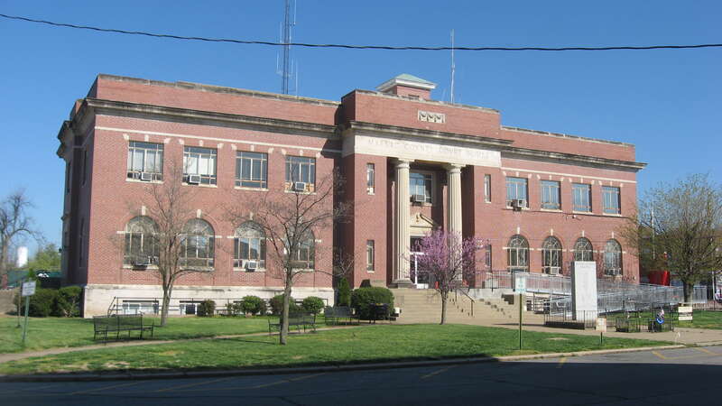 Front and southern end of the Massac County Courthouse, located on the public square in Metropolis, Illinois, United States.  Built in 1942, it replaced a previous structure completed eighty years earlier.