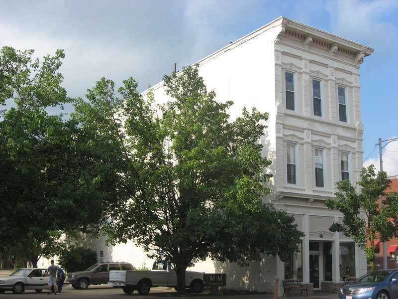 Western side and front of the McCarthy-Blosser-Dillon Building, located at 4 W. Main St. in Logan, Ohio, United States.  Built in 1883, it is listed on the National Register of Historic Places, and it is part of a Register-listed historic district,