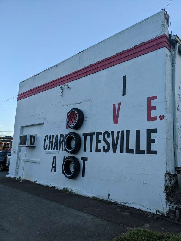 Mural at Fitzgerald's Tires, 408 Monticello Road in Belmont neighborhood, Charlottesville, Virginiaː &quot;I LOVE CHARLOTTESVILLE A LOT&quot; (with three tires)