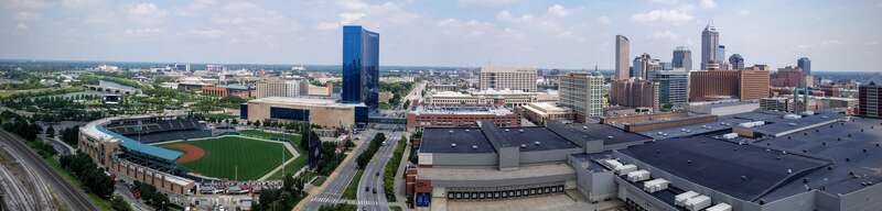 This photo was captured atop the smokestacks of the Perry K. Steam Plant, directly to the southwest of downtown Indianapolis. Victory Field and the Indiana Convention Center along West Street are visible in the foreground.