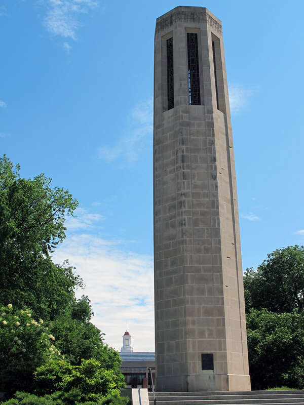 Photo of the Ralph Mueller Carillon Tower (1306 &quot;U&quot; Street; foreground, right of center) and Don L. Love Memorial Library (1248/1300 &quot;R&quot; Street; background, bottom-left of center).  Both are on the University of Nebraska-Lincoln city campus in