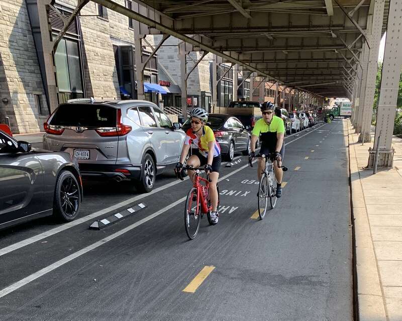 This photo, taken in Washington Aug. 29, 2019, shows a two-way separated bike lane with parking as a barrier between bicyclists and moving traffic.  (NTSB photo by Ivan Cheung.)
