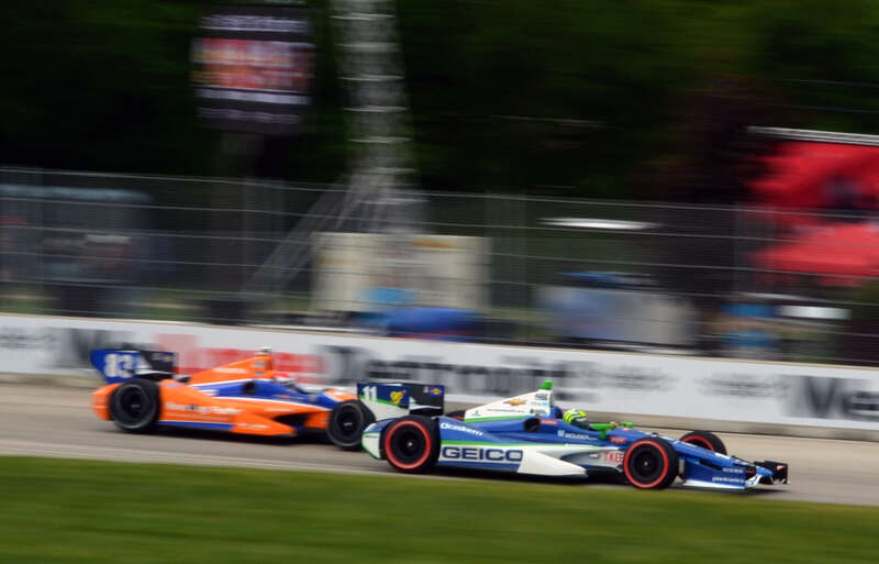 Tony Kanaan ahead of Charlie Kimball during the 2012 Detroit Belle Isle Grand Prix