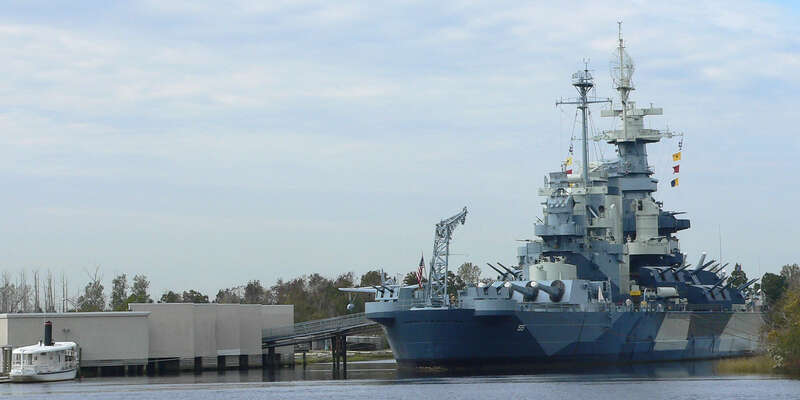 The USS North Carolina, a WW2-era US Navy battleship which now rests near the mouth of the Cape Fear River in Wilmington, NC where she serves as a floating museum and war memorial.Photo taken with a Panasonic Lumix DMC-FZ50 in New Hanover County, NC,