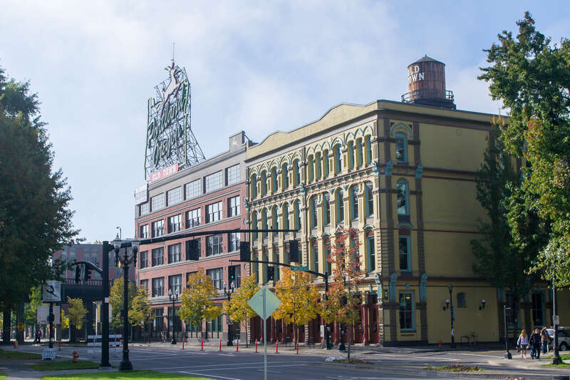 The White Stag Block, Portland campus of the University of Oregon. This view is looking southwest across the intersection of NW Naito Parkway (formerly Front Avenue) and Couch Street. The building closest to the camera is the Bickel Block (not to be