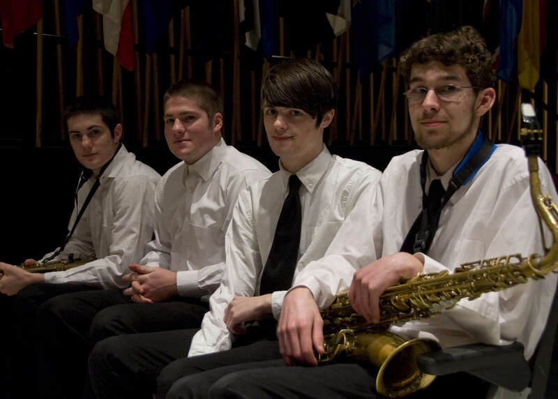 110313-N-5508A-008 Bangor, Me  (March 21, 2011) Four lucky students at Bangor High School prepare to join the Navy Band on stage for a performance of Sousa's &quot;Washington Post March&quot;. The Navy band is currently on a 22 day tour of the Northeast US.