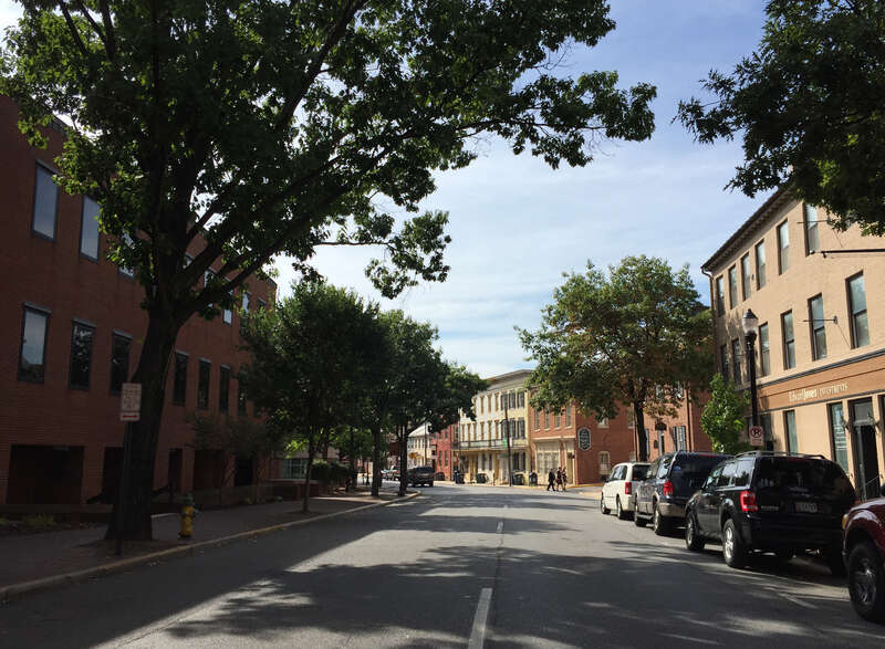 View west along Maryland State Route 144 (Patrick Street) at Court Street in Frederick, Frederick County, Maryland