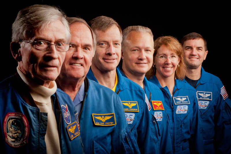 JSC2011-E-205603 (2 Nov. 2011) --- The current and former astronauts who formed the crews of STS-1, the first space shuttle mission, and STS-135, the final shuttle mission, pose for a group photo at the Johnson Space Center in Houston on Nov. 2,