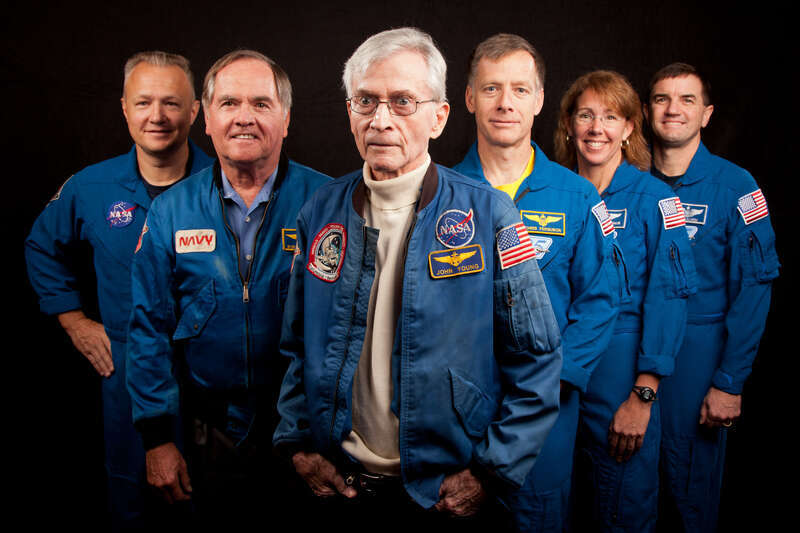 JSC2011-E-205613 (2 Nov. 2011) --- The current and former astronauts who formed the crews of STS-1, the first space shuttle mission, and STS-135, the final shuttle mission, pose for a group photo at the Johnson Space Center in Houston on Nov. 2,