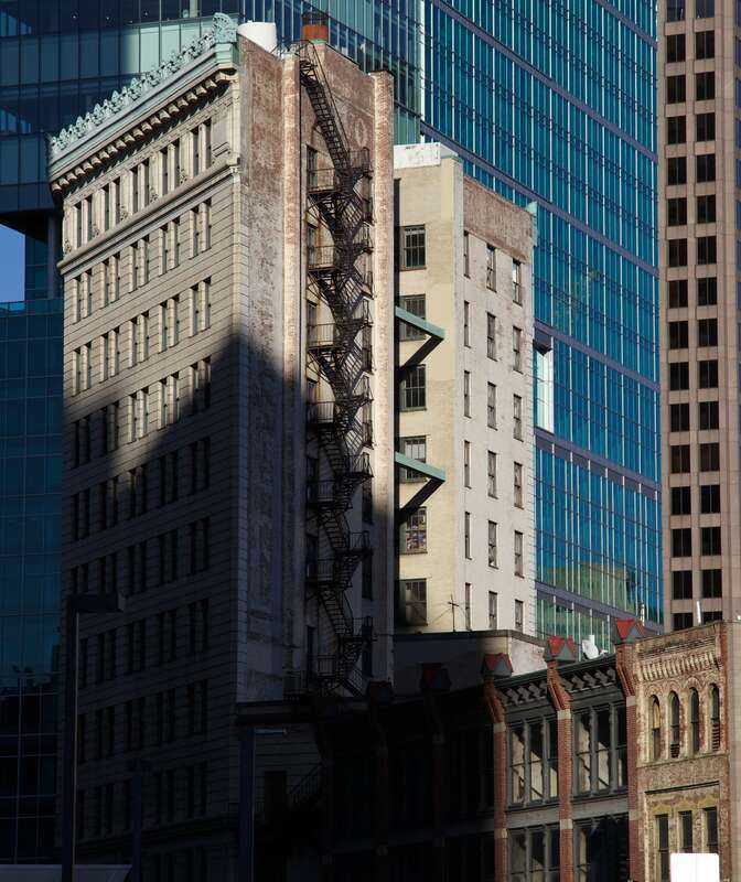 The Diamond Building in Pittsburgh with tall fire escape.  Built in 1905 and designed by MacClure &amp;amp; Spahr.

I thought the light and shadow was pretty nice on these buildings.