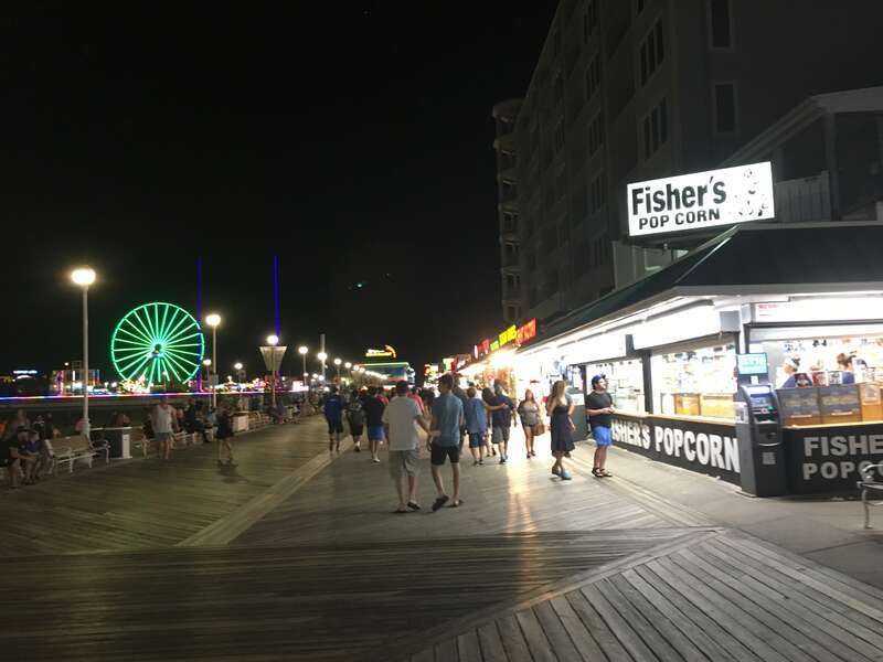 A view of the boardwalk in Ocean City, Maryland at Talbot Street looking south at night