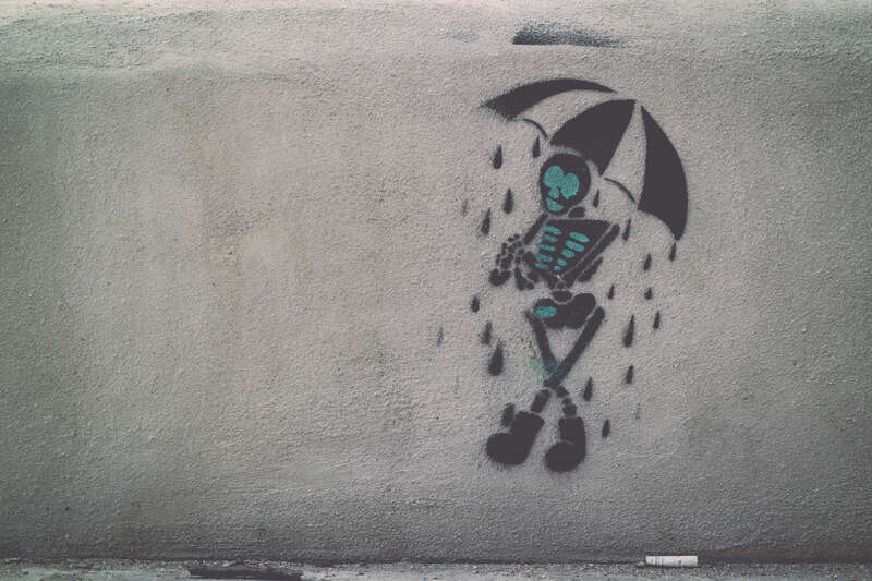Skeleton with an Umbrella Street Art on South Congress Austin