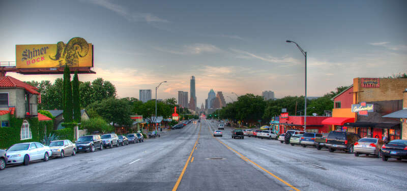 SoCo, the surrounding area of South Congress Avenue, is a vibrant area of Austin, TX. The avenue leads directly into downtown Austin, ending at the state capitol.