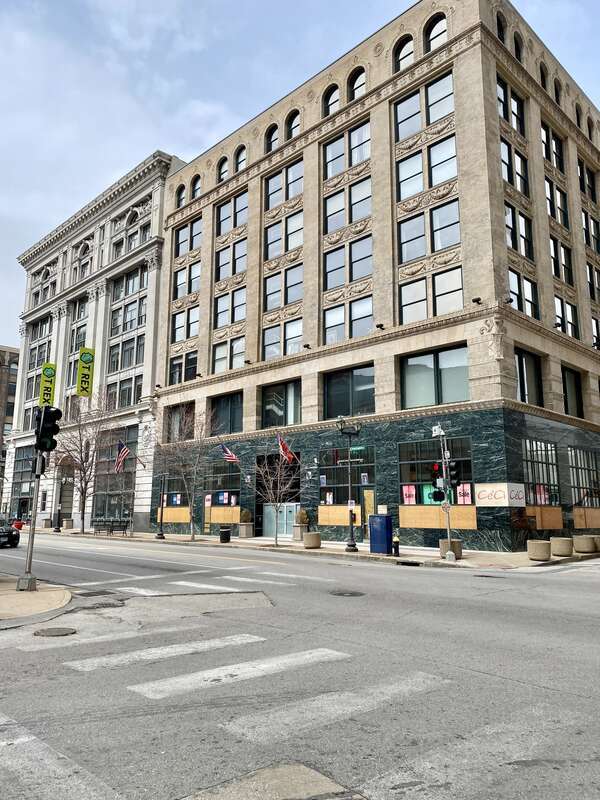 Lammert Building (Eames and Young, 1898) and Bankers Lofts (Shepley, Rutan and Coolidge, 1892) visible in the background.  The buildings are contributing structures in the Washington Avenue East of Tucker Historic District, listed on the National